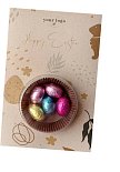 chocolate eggs in a nest with logo print